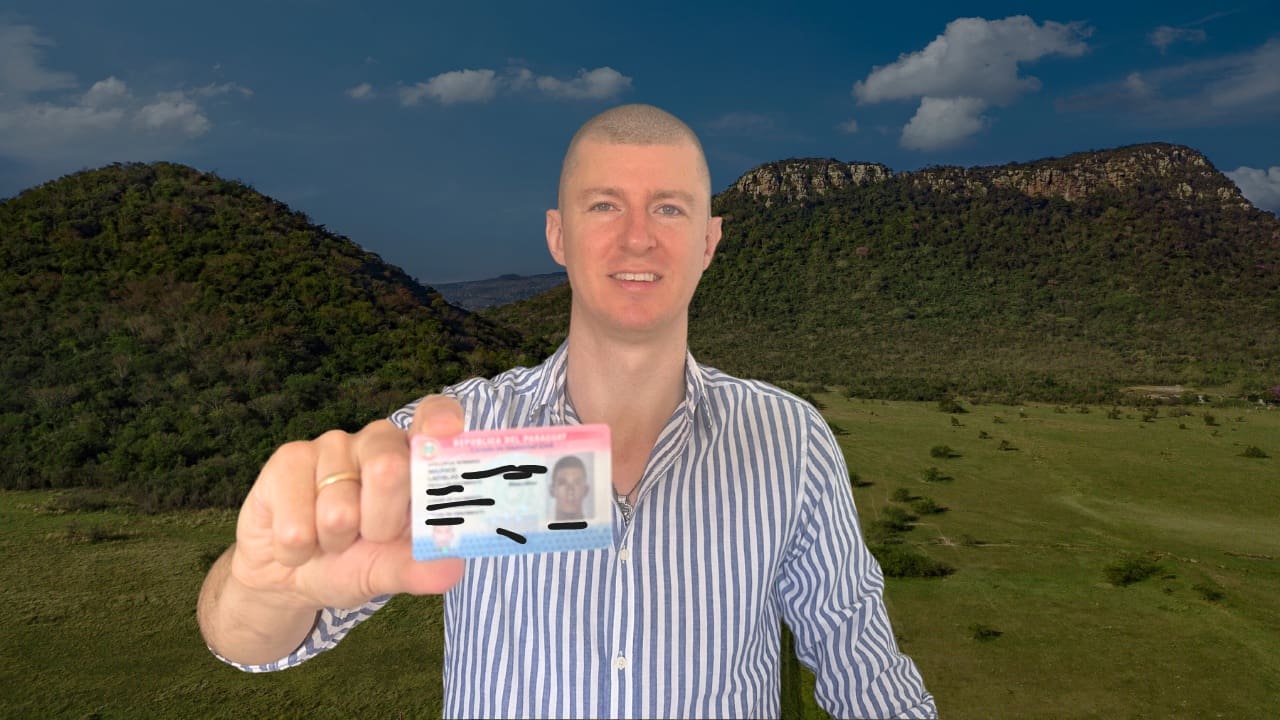 Ladislas holding his Paraguay Residency Card