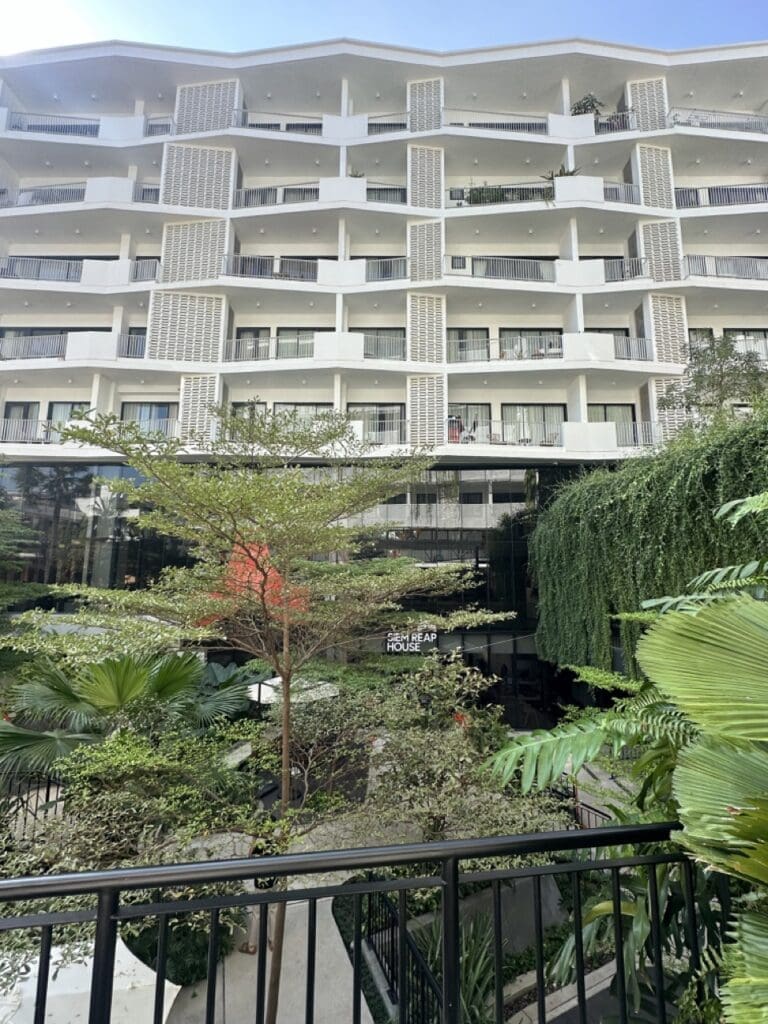 building in Siem Reap, showcasing greenery and a clean architectural design
