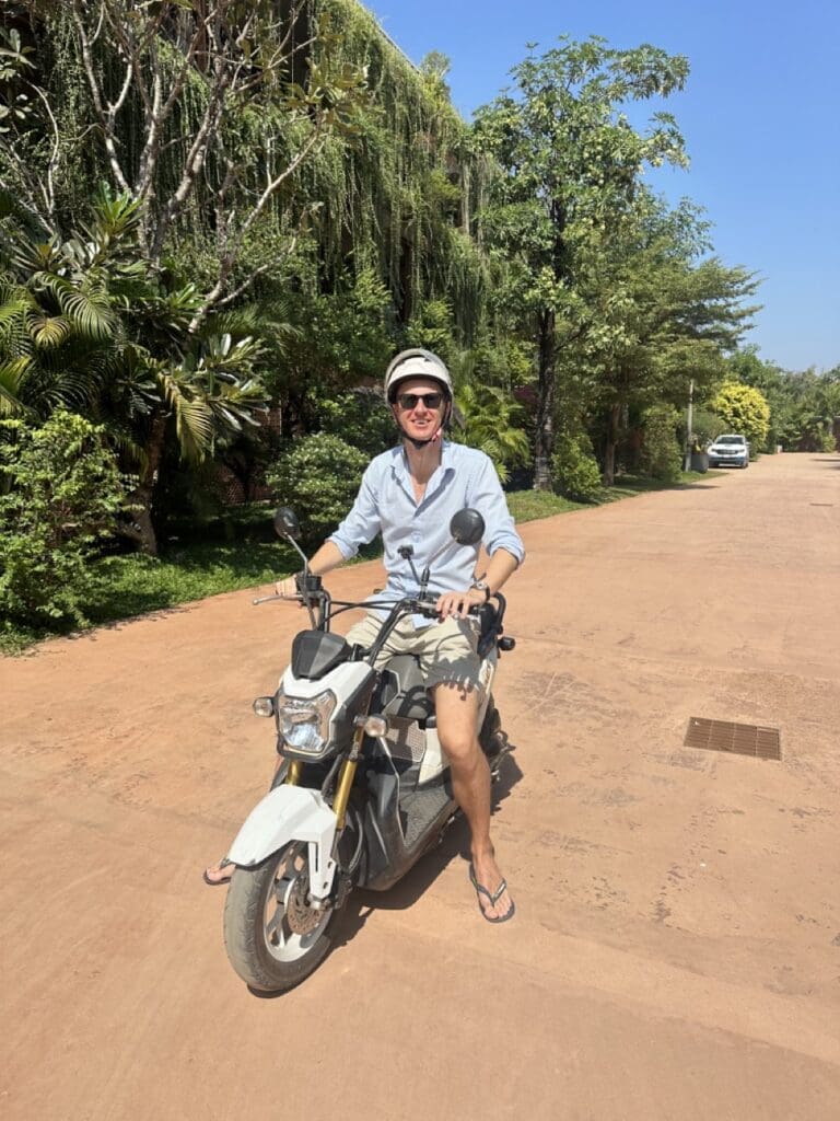 Ladislas on his scooter researching the Siem Reap real estate market in Cambodia
