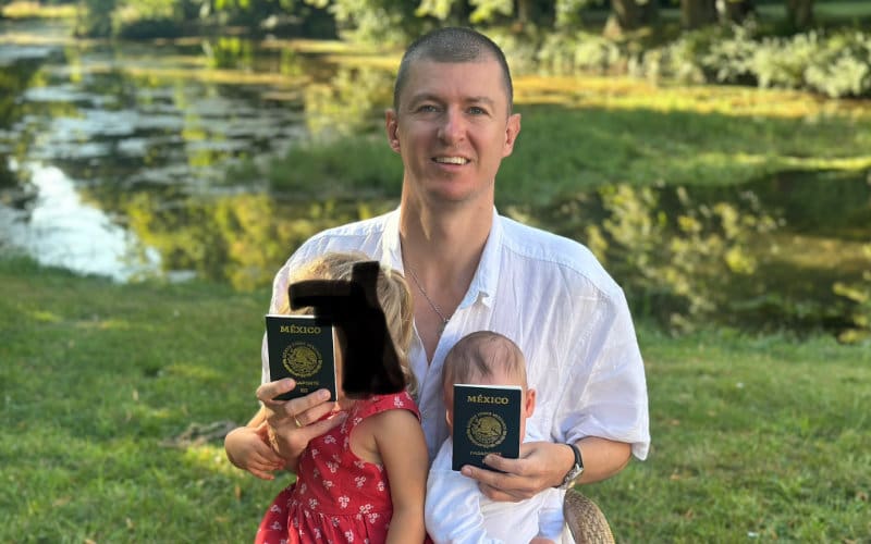 Ladislas holding his new baby and Mexican passport