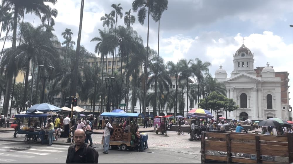 Central square of Cali with buildings and people Central square of Cali with buildings and people