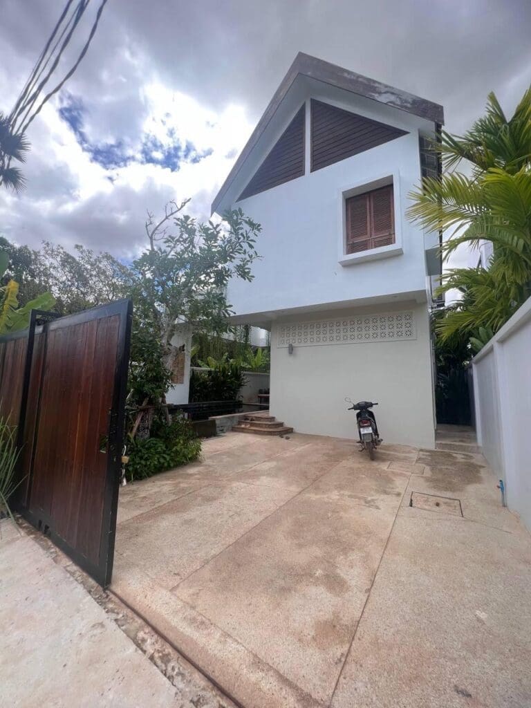 Exterior of a 3-bedroom villa, a Airbnb investment in Siem Reap, showing modern architecture and a gated entrance