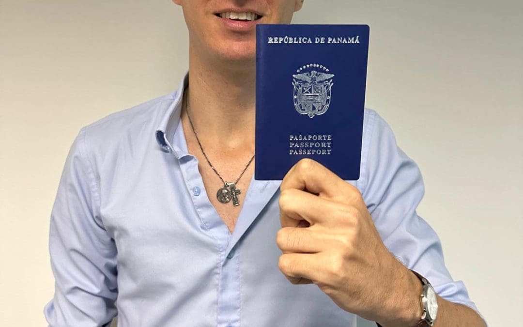 white man holding panama passport