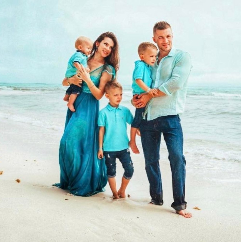 white family with three children on beach