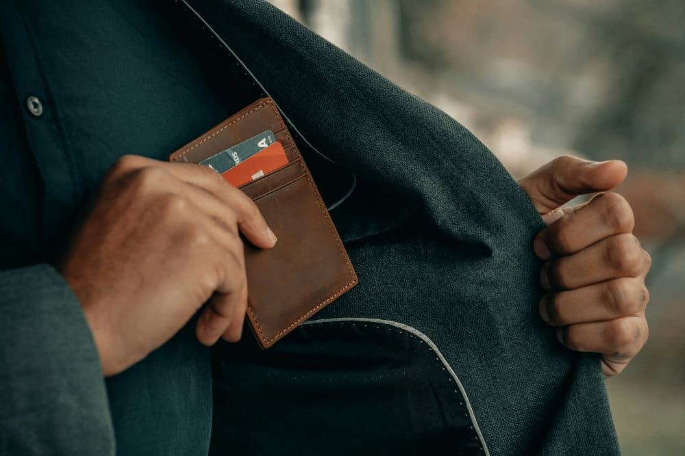 man with wallet ready to open an offshore bank account